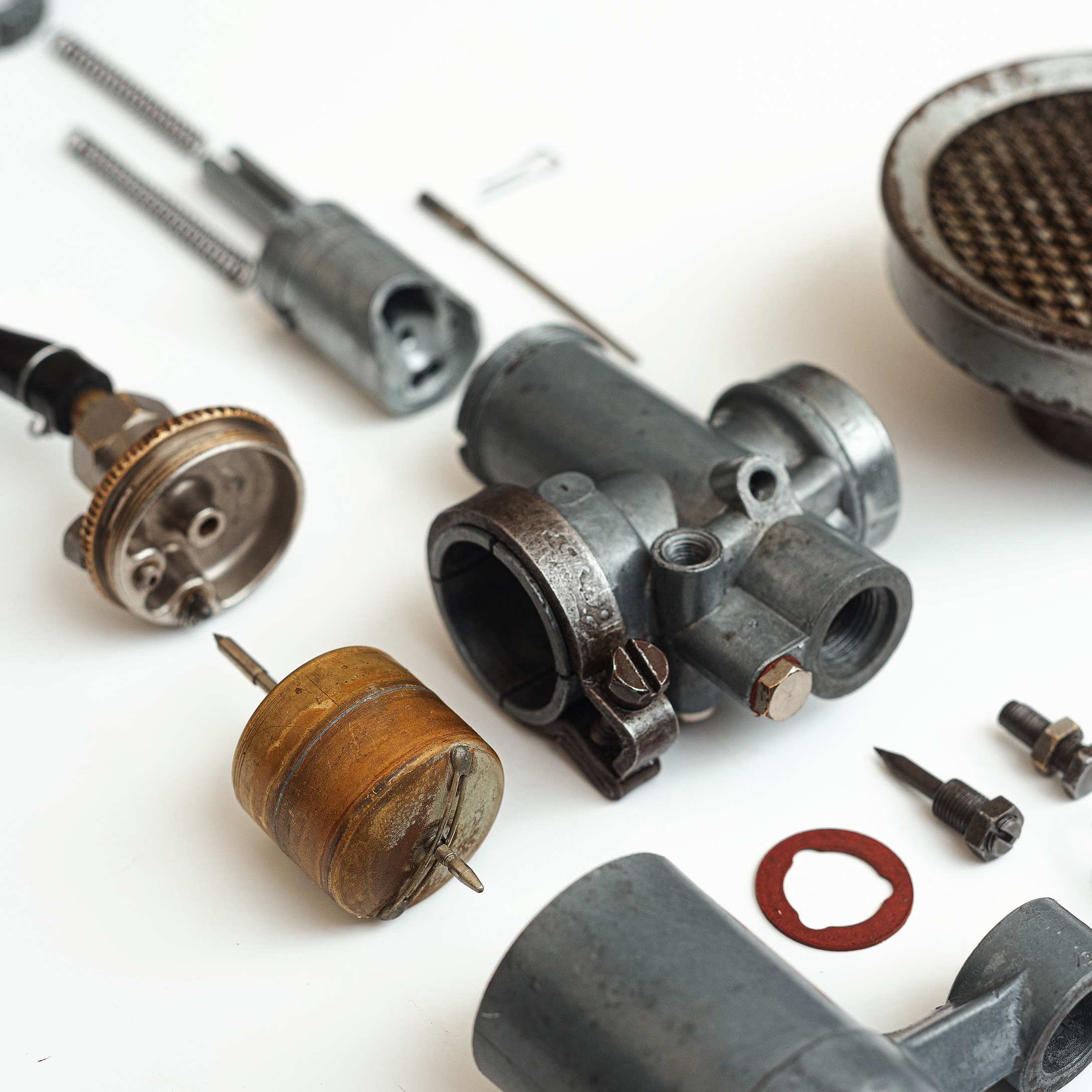 Detailed image of industrial machinery components arranged on a white surface